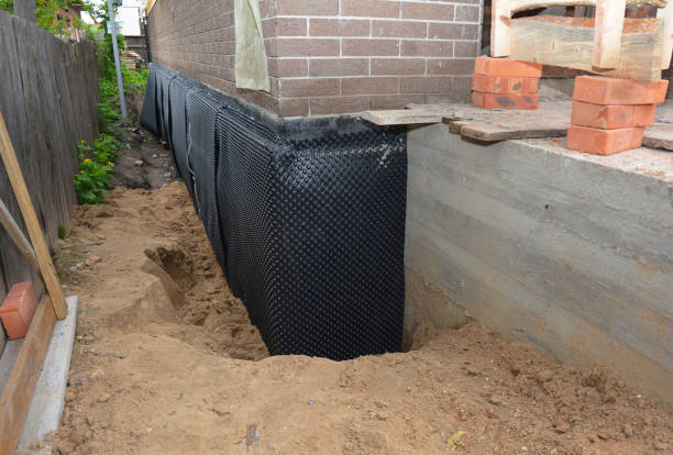 SJ Waterproofing Pros technician performing targeted Emergency Waterproofing assessment in Ferndale, MD